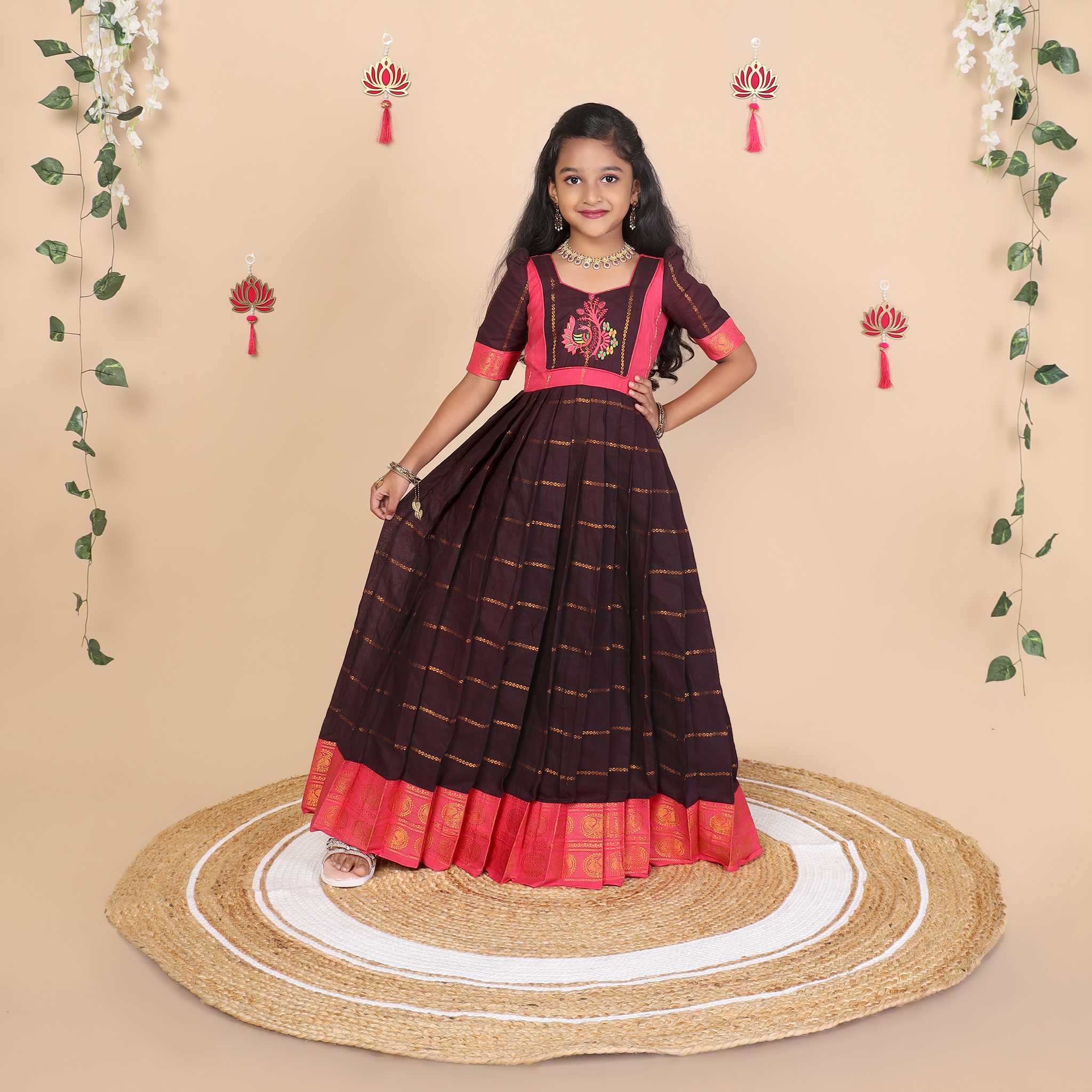 Front view of deep brown and pink ethnic long gown for girls