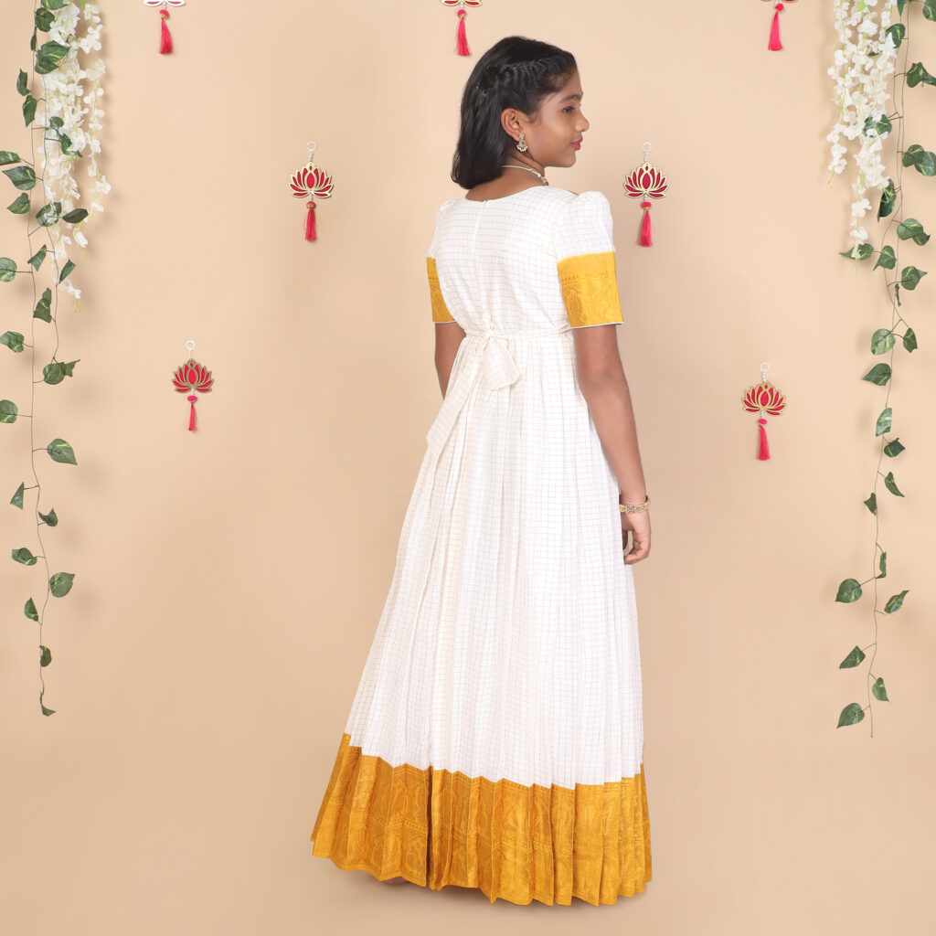 Back view of mustard and white ethnic long gown for girls