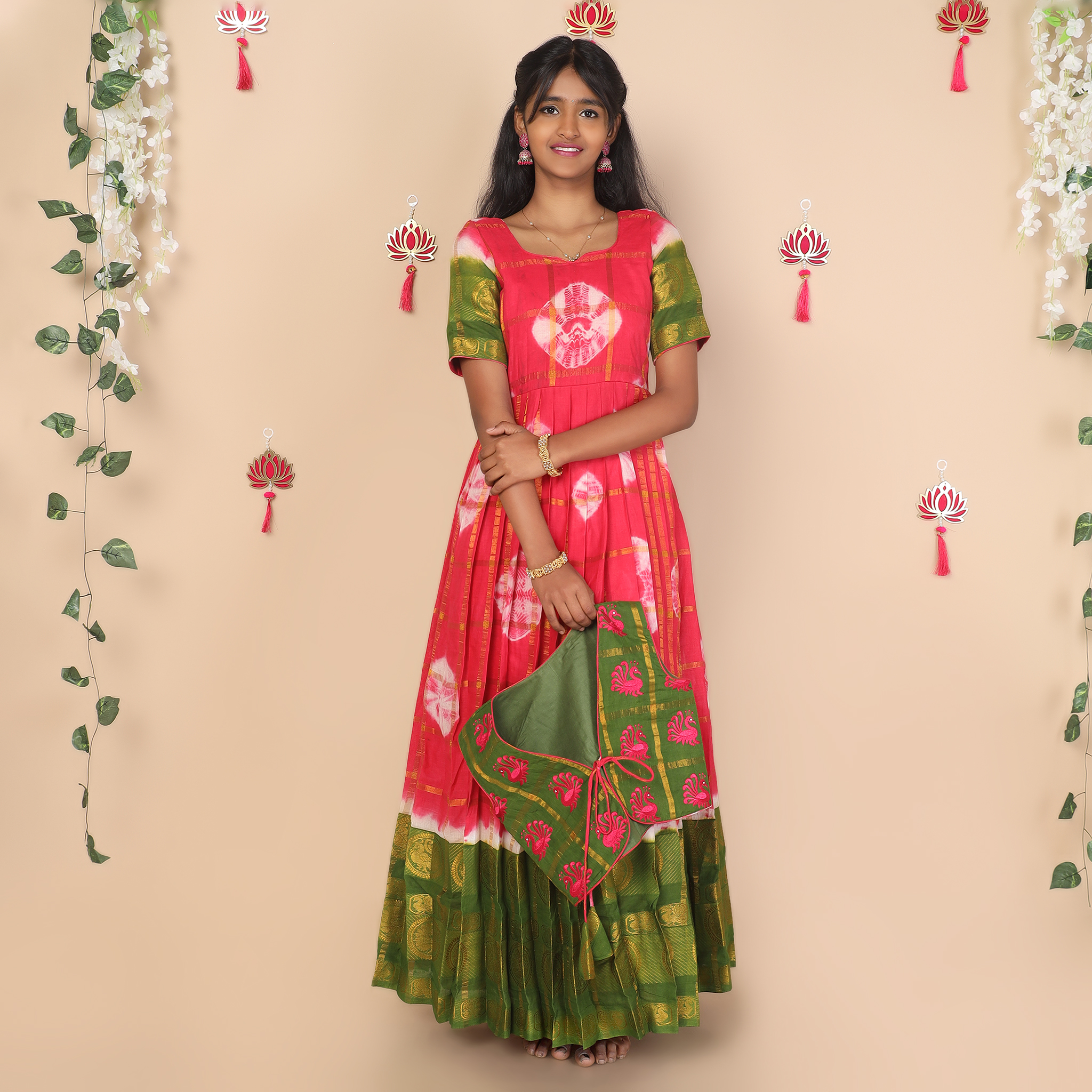 Front of pink and green ethnic jacket for girls