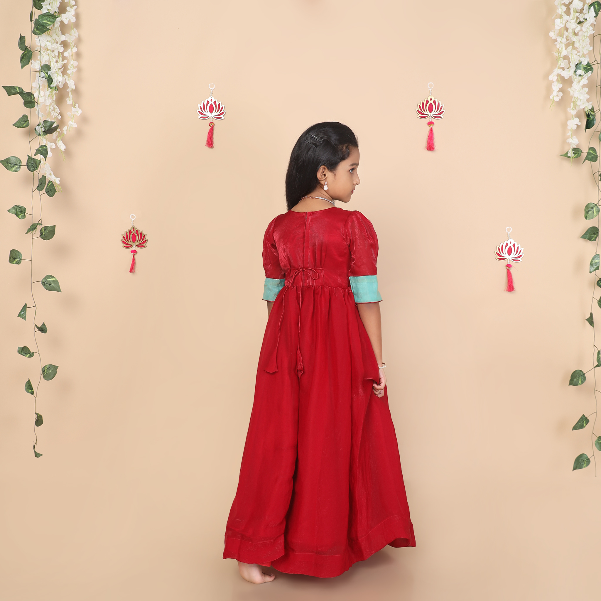 Back view of Yazh Nila shimmery silk girls long gown