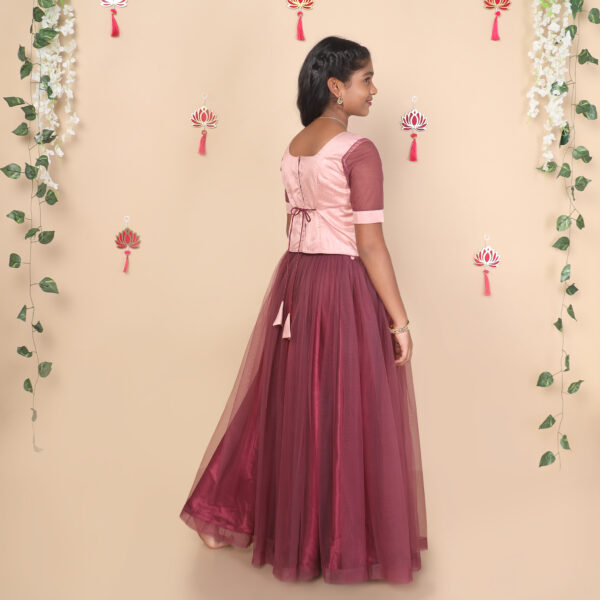 Back view of mauve girls skirt and top set with dori tie closure