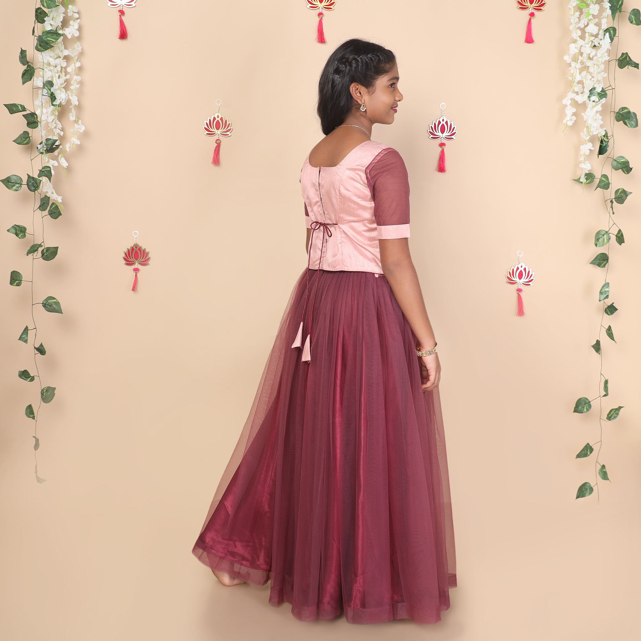 Back view of mauve girls skirt and top set with dori tie closure