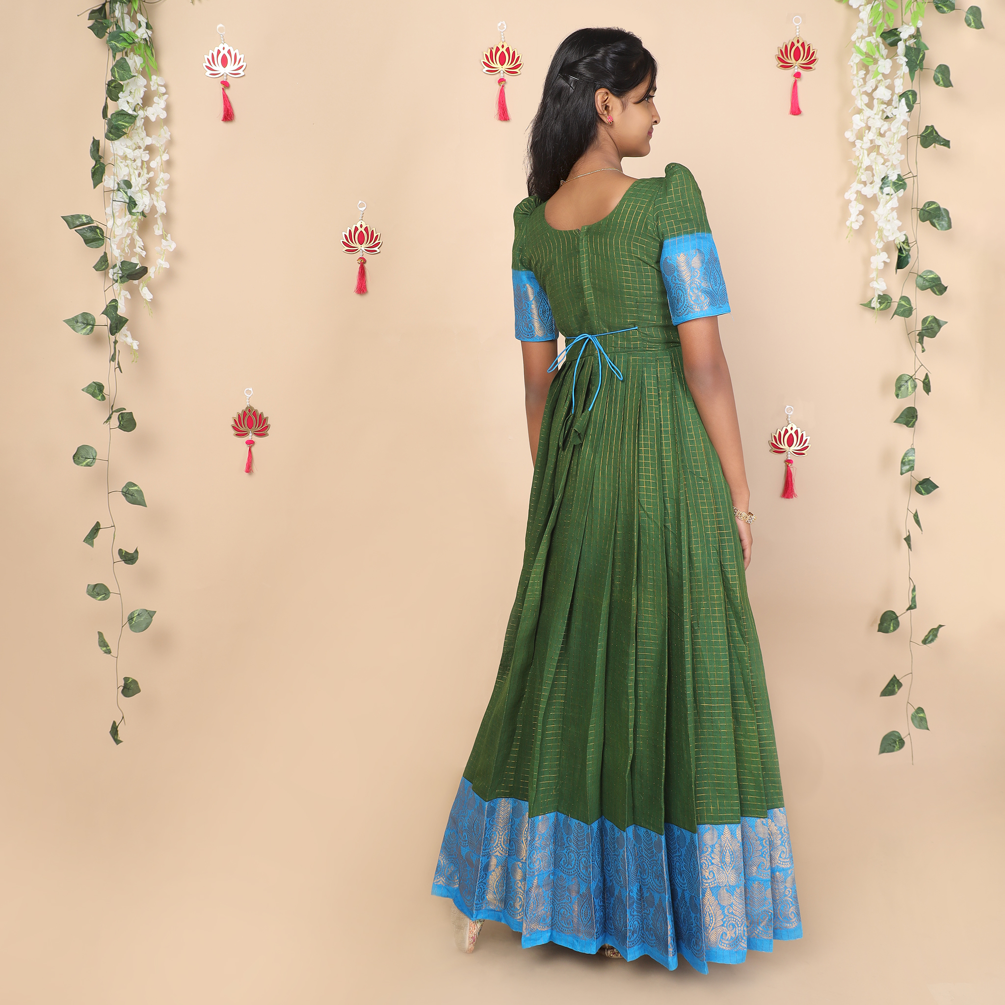 Back view of olive green and blue ethnic long gown for girls