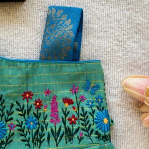 One shoulder design detail of kids festive frock