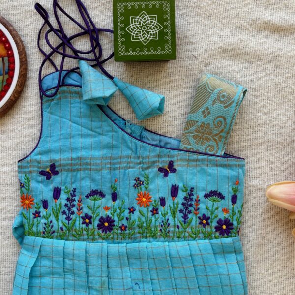 Floral embroidery on teal kids frock