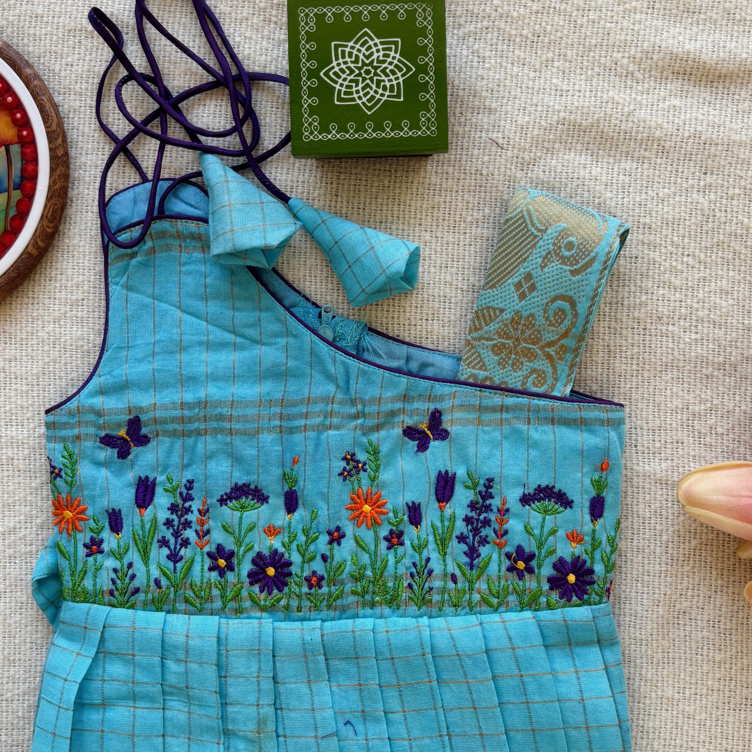 Floral embroidery on teal kids frock