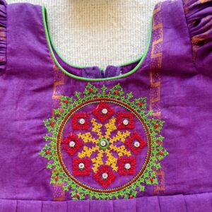 Embroidered bodice design on purple kids frock