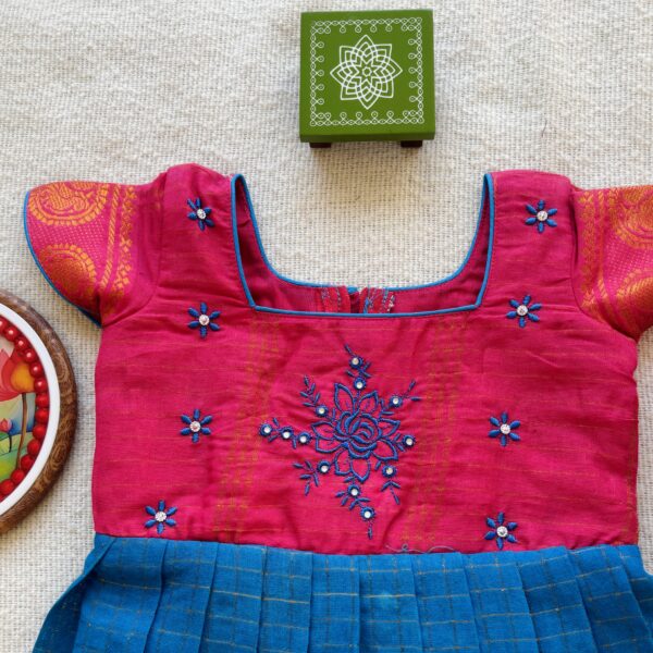 Embroidered pink bodice of kids frock
