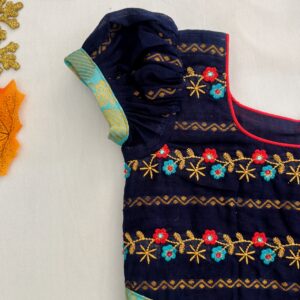 Sleeve detail of navy blue embroidered traditional kids frock