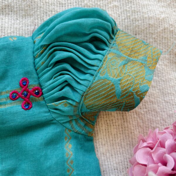 Puff sleeve detail of teal kids festive frock