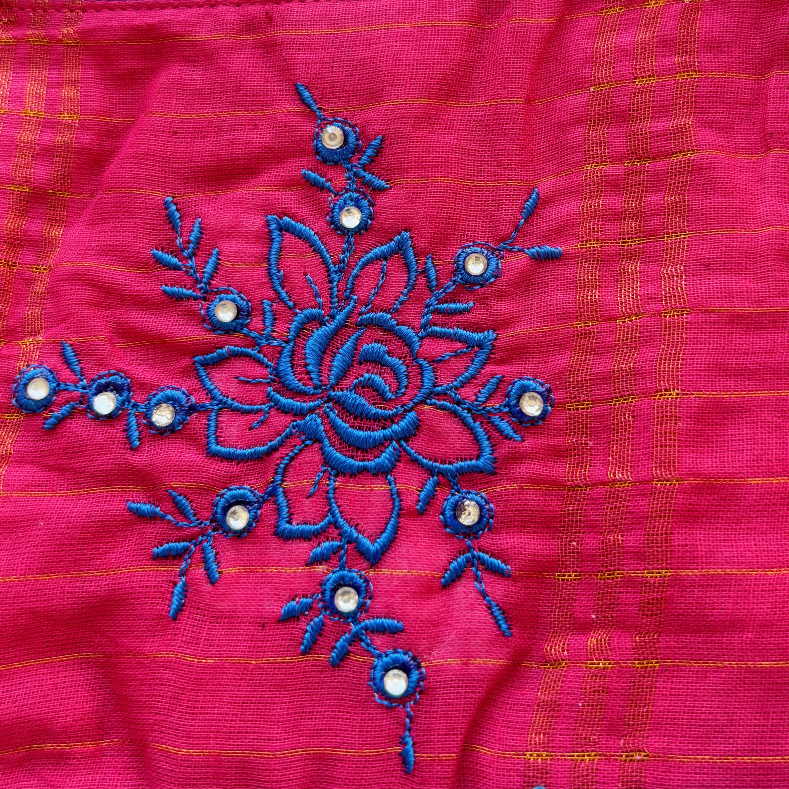 Close up embroidery work on kids festive frock