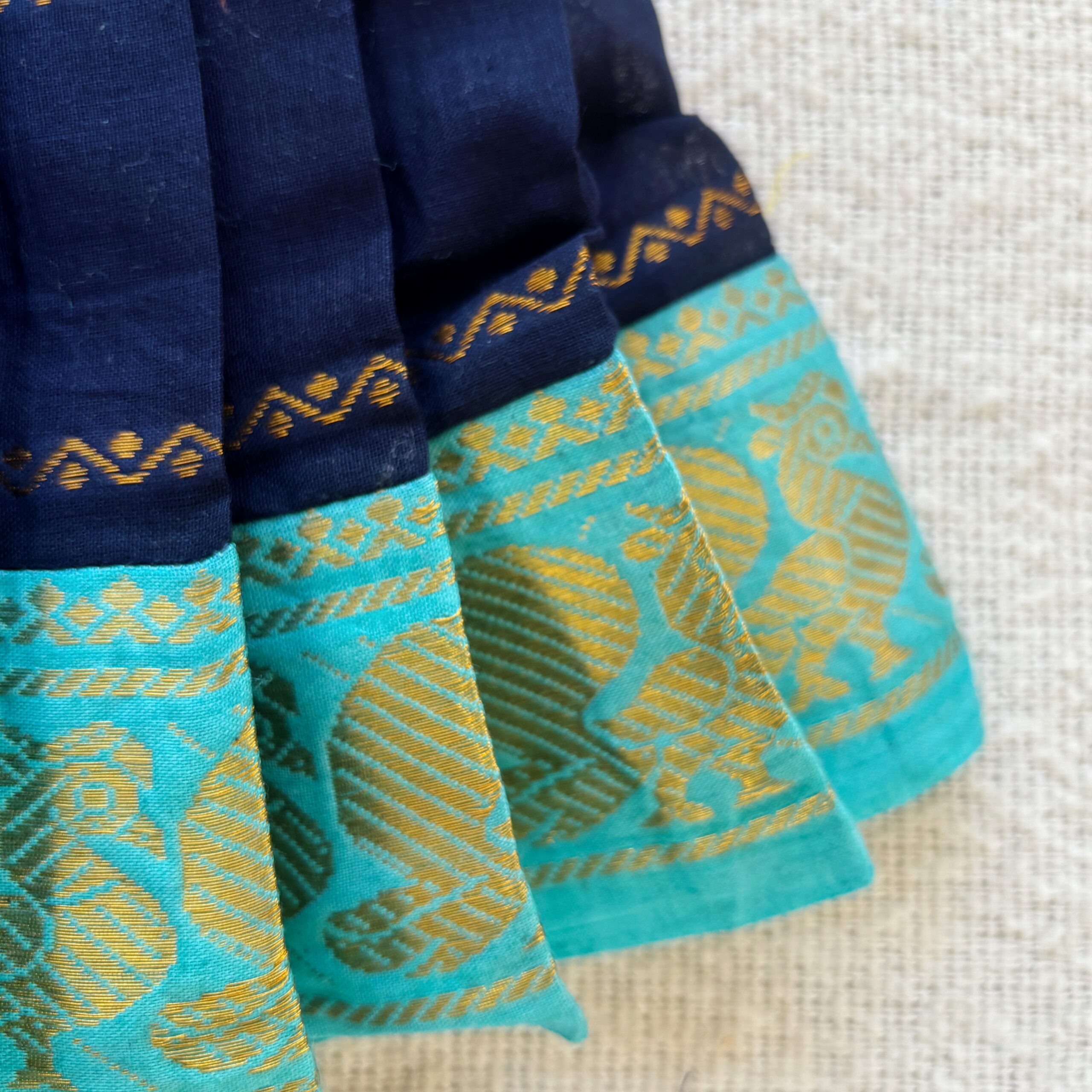 Teal traditional zari border detail of navy blue kids frock