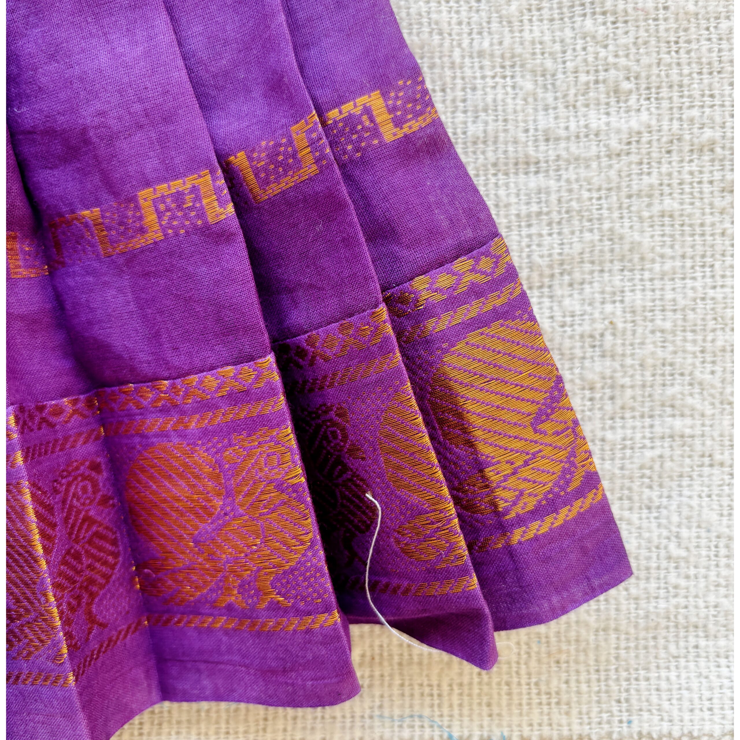 Traditional zari border detail of purple kids frock