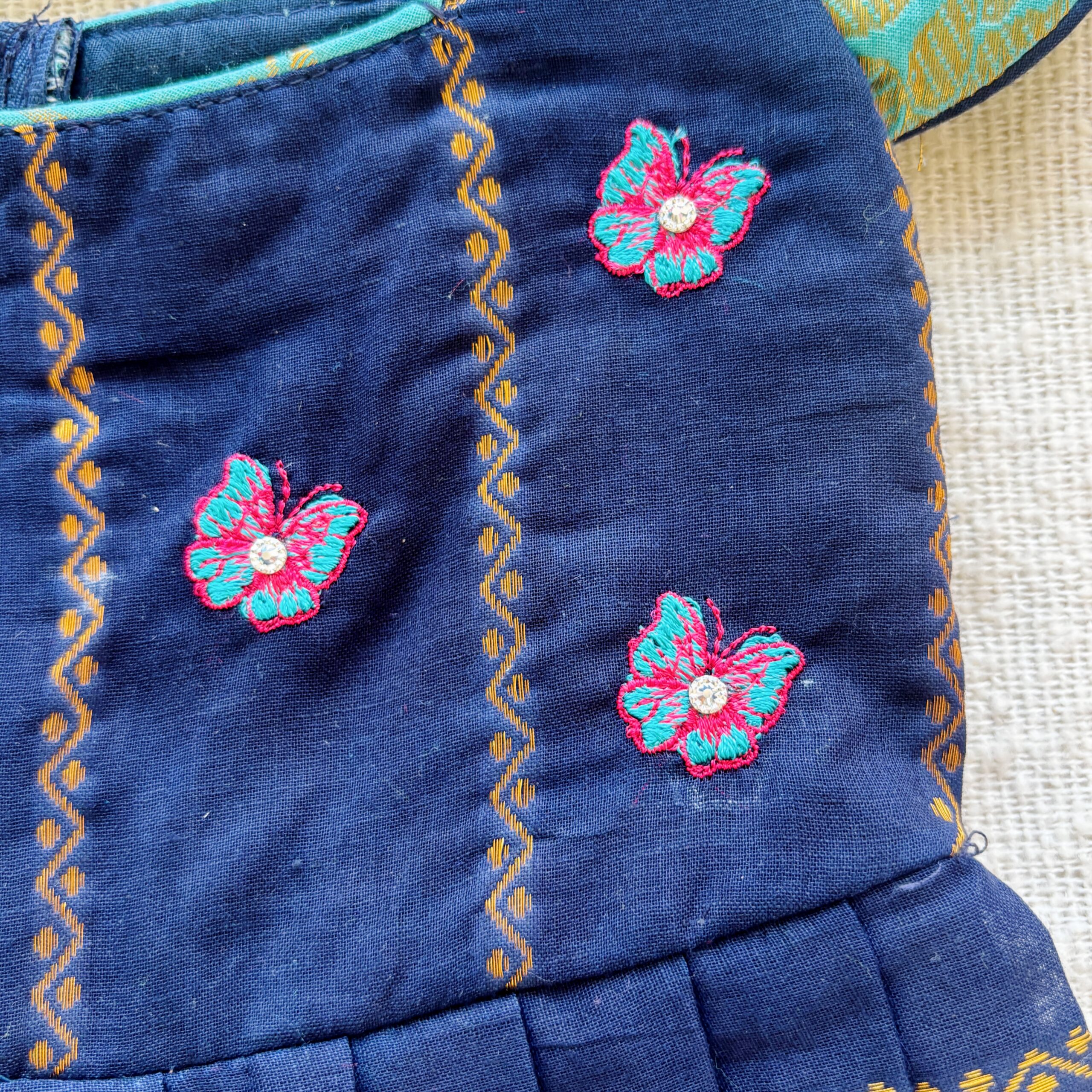 Close up embroidery work on kids festive frock