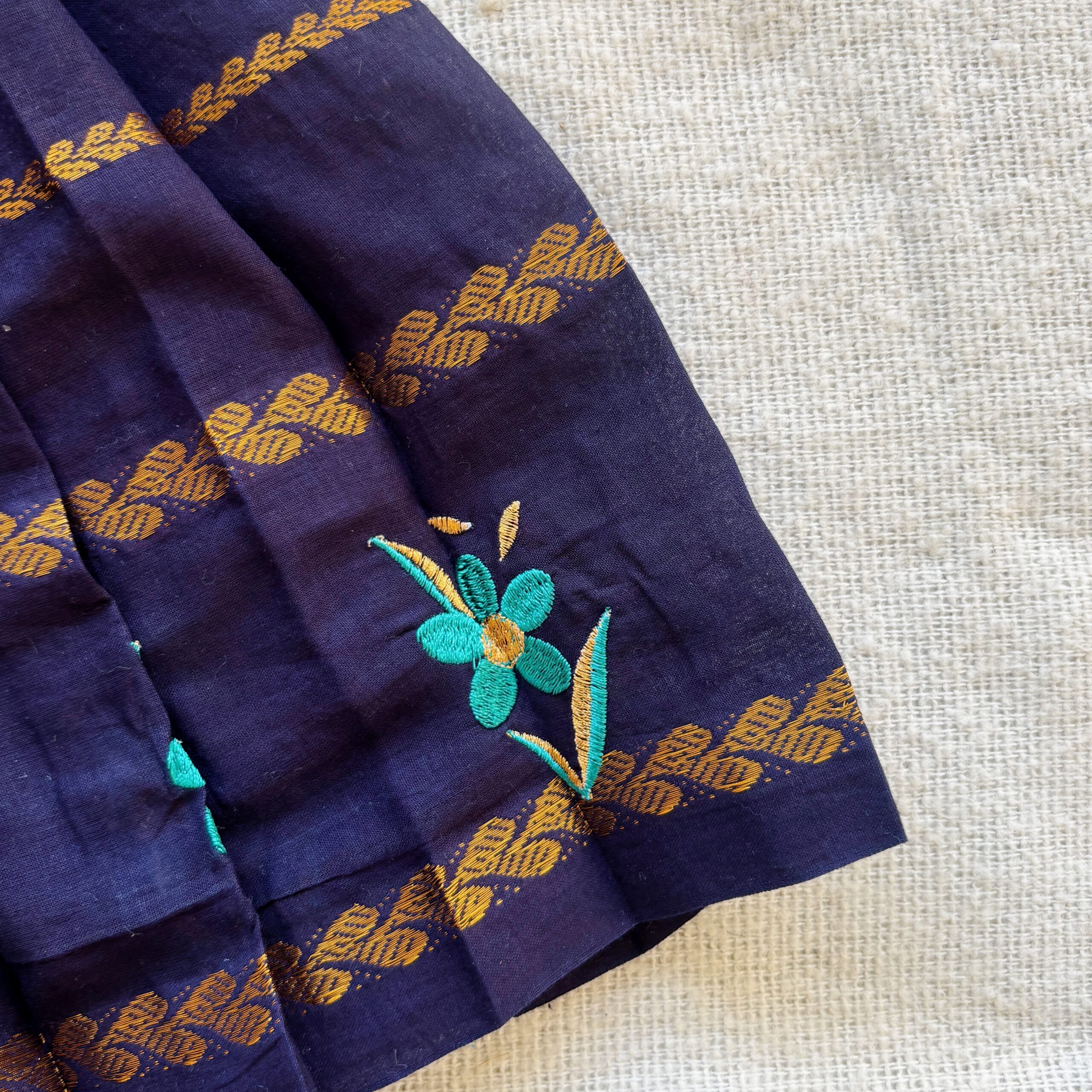 Floral border detail of navy kids frock