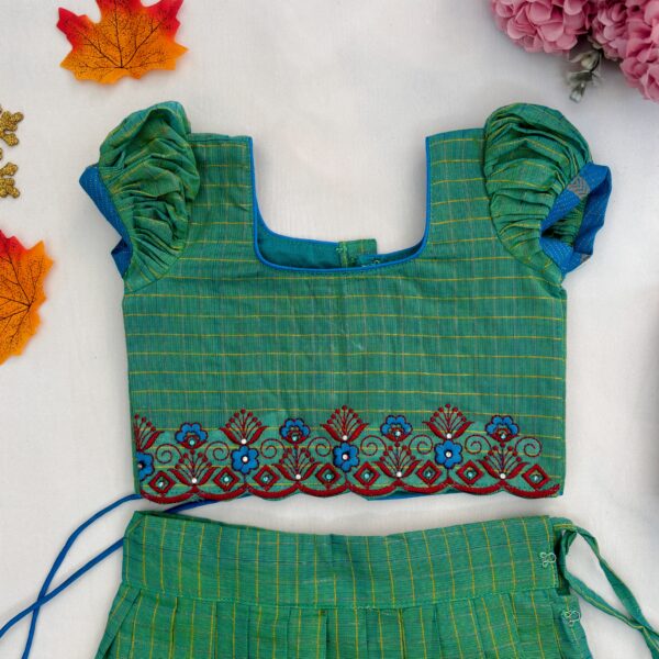 Top view embroidered neckline of green kids crop top