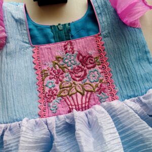 Pastel blue embroidered girls frock with flower pot thread embroidery