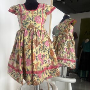 Yellow floral cotton frock for girls with handcrafted block print by Varna Design Wear