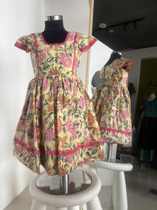 Yellow floral cotton frock for girls with handcrafted block print by Varna Design Wear