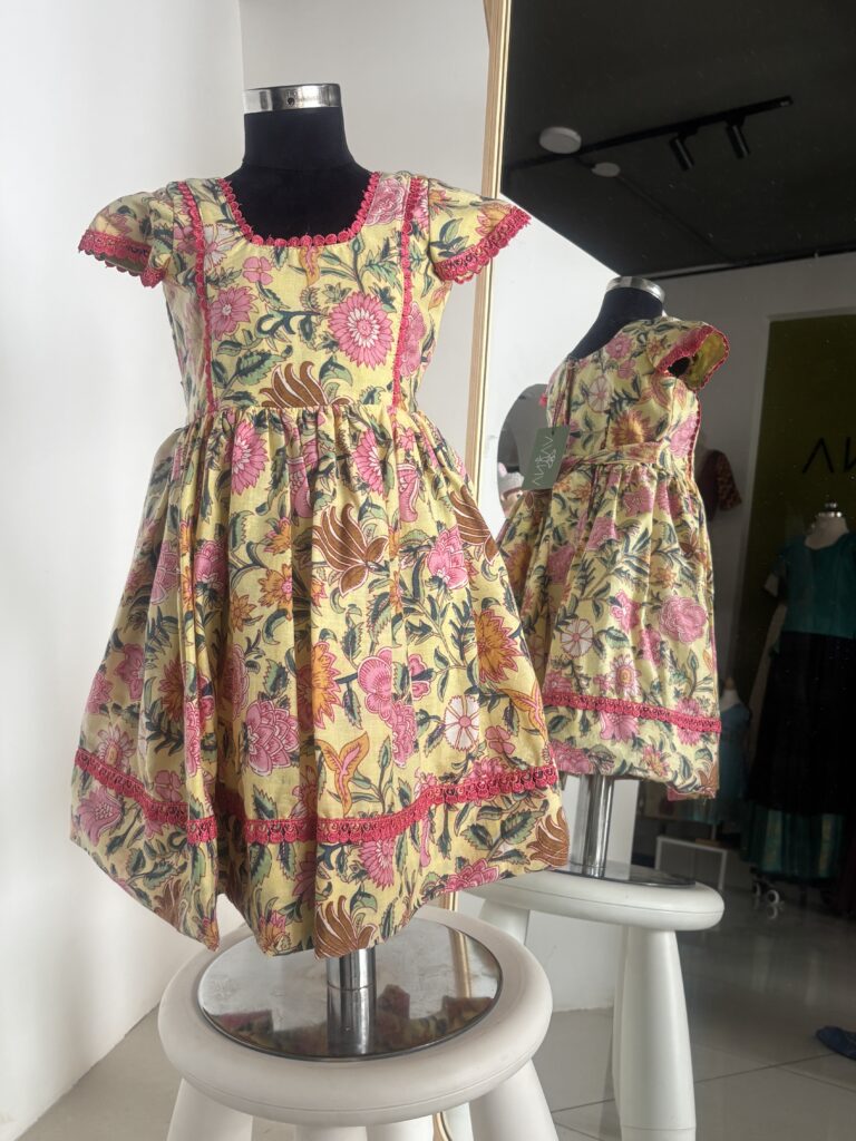 Yellow floral cotton frock for girls with handcrafted block print by Varna Design Wear