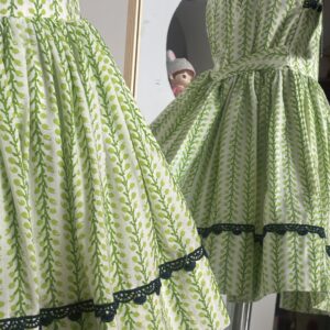 Green cotton girls frock with black lace border detail