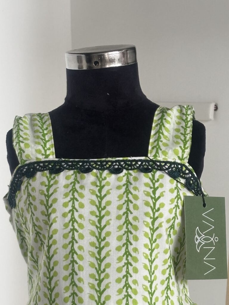 Front view of green cotton girls frock with square neckline