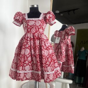 Red cotton girls frock with white floral block print and puff sleeves by Varna Design Wear