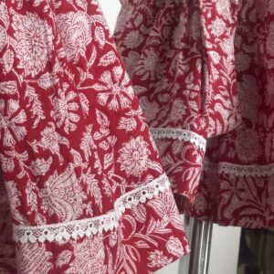 Red cotton girls frock with floral print and white lace border