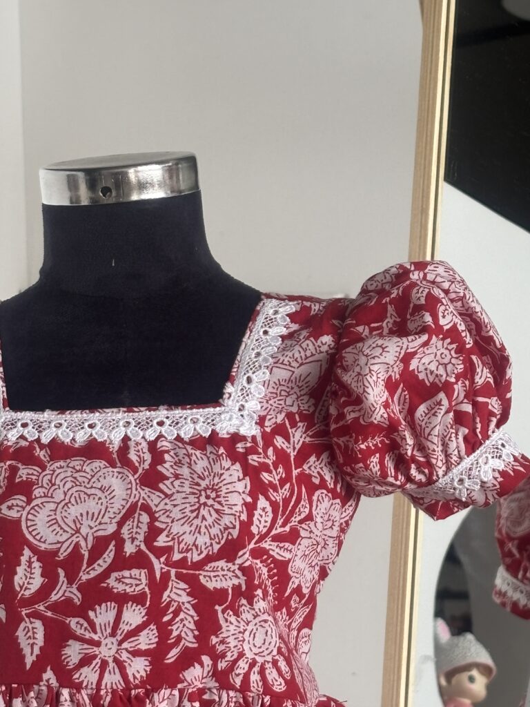 Side view of red floral cotton frock for girls