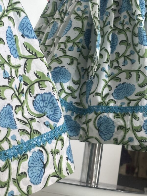 Blue cotton girls dress with floral print and lace border detail