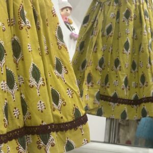 Yellow cotton girls frock with decorative lace detail