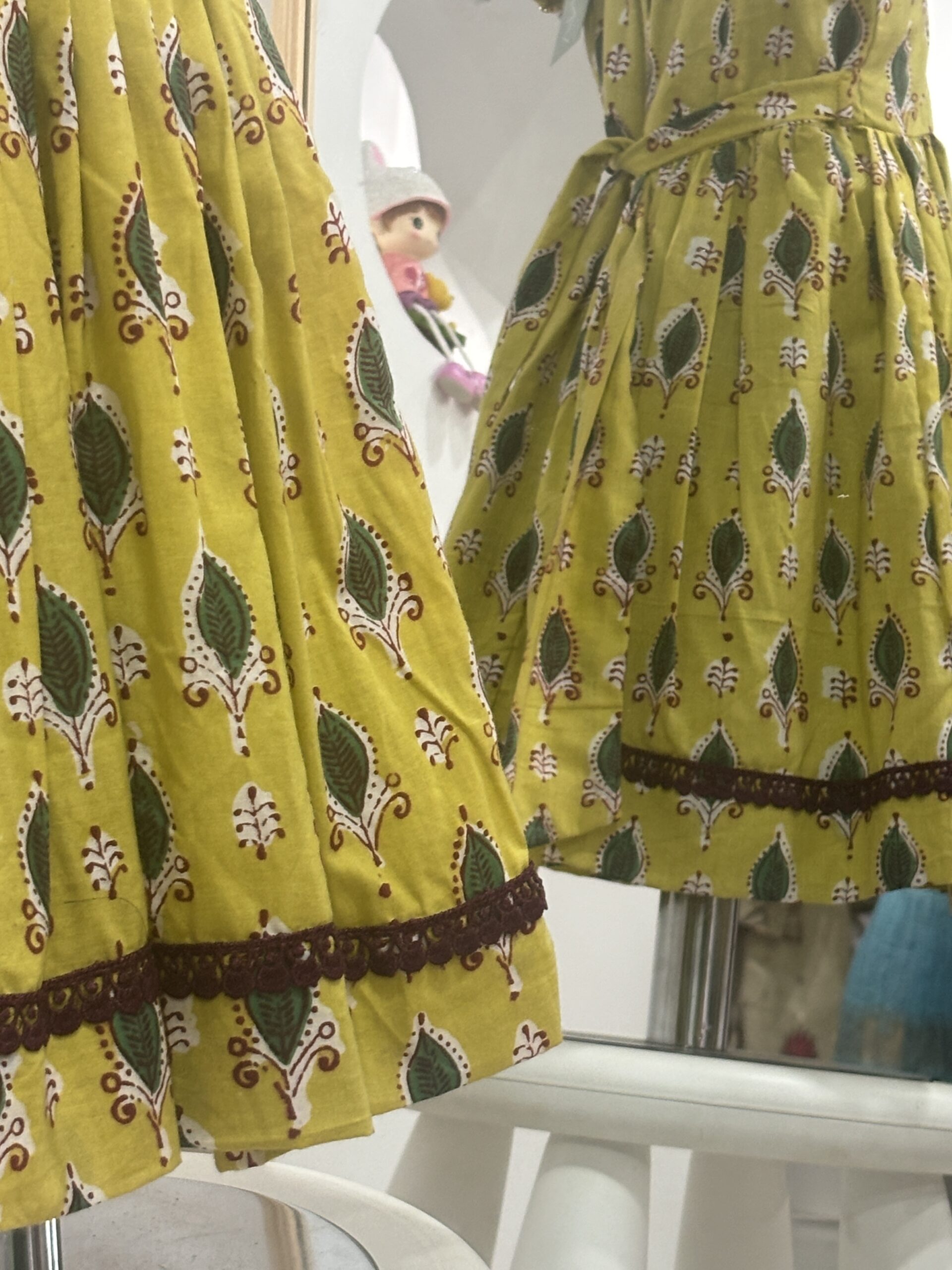 Yellow cotton girls frock with decorative lace detail