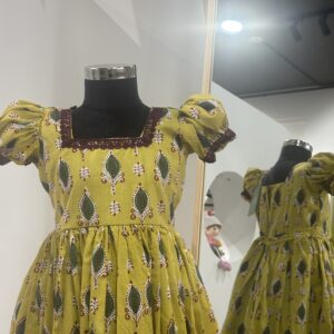 Traditional yellow cotton girls frock for festive occasions