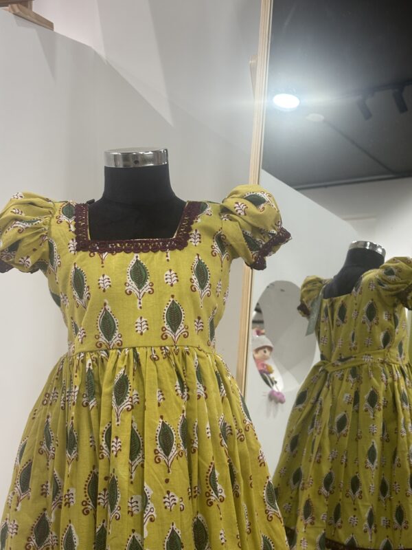 Traditional yellow cotton girls frock for festive occasions