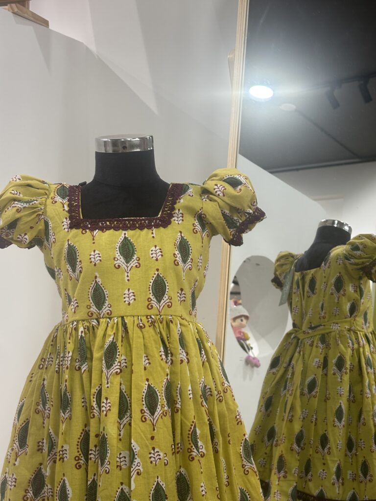 Traditional yellow cotton girls frock for festive occasions