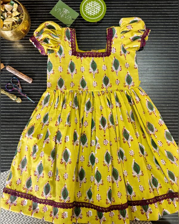 yellow cotton girls frock with puff sleeves front view