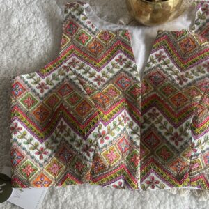 White designer print sleeveless blouse