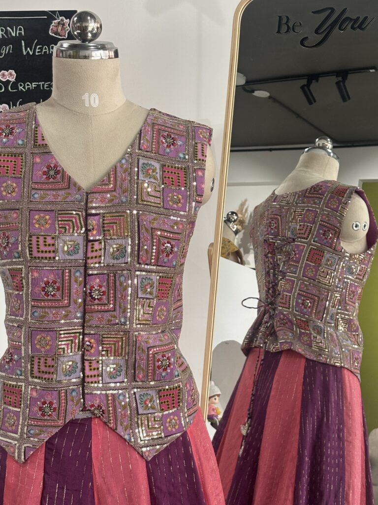 Purple and peach designer panel lehenga with sleeveless jacket style blouse by Varna Design Wear