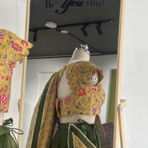 Back design of floral scallop blouse with tie-up detail