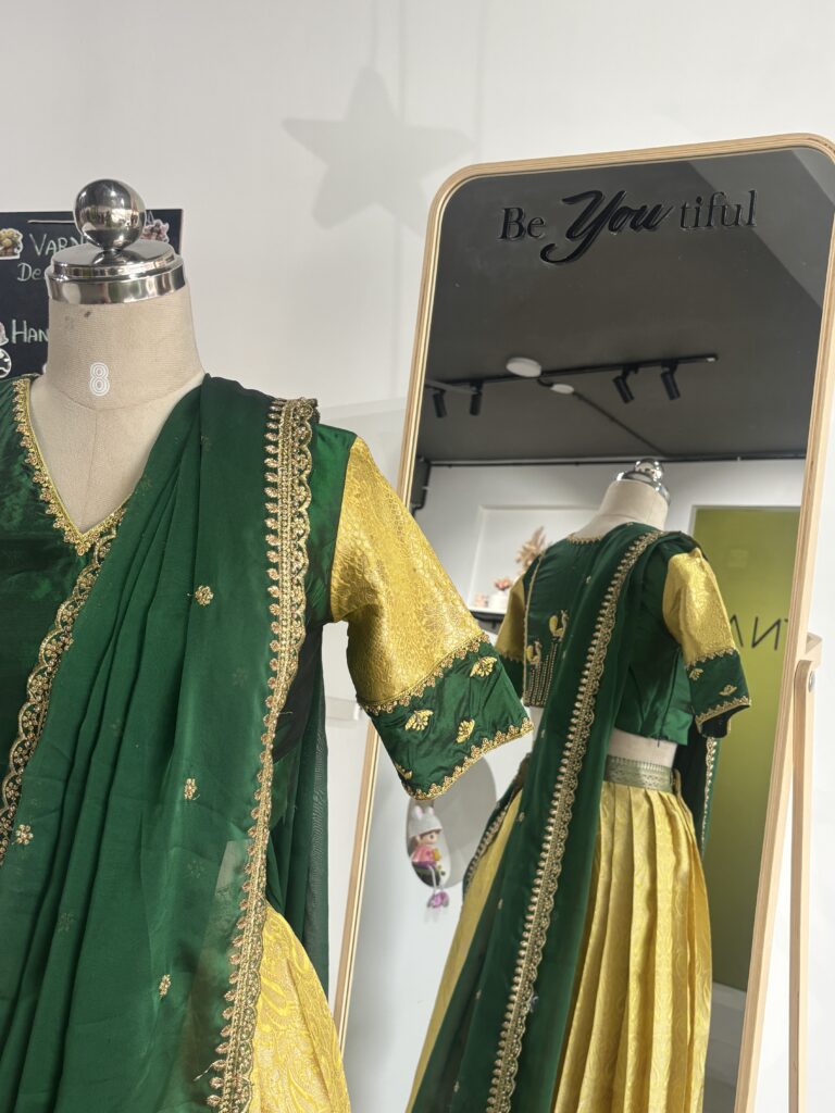 Lemon yellow brocade lehenga skirt with bottle green zari border