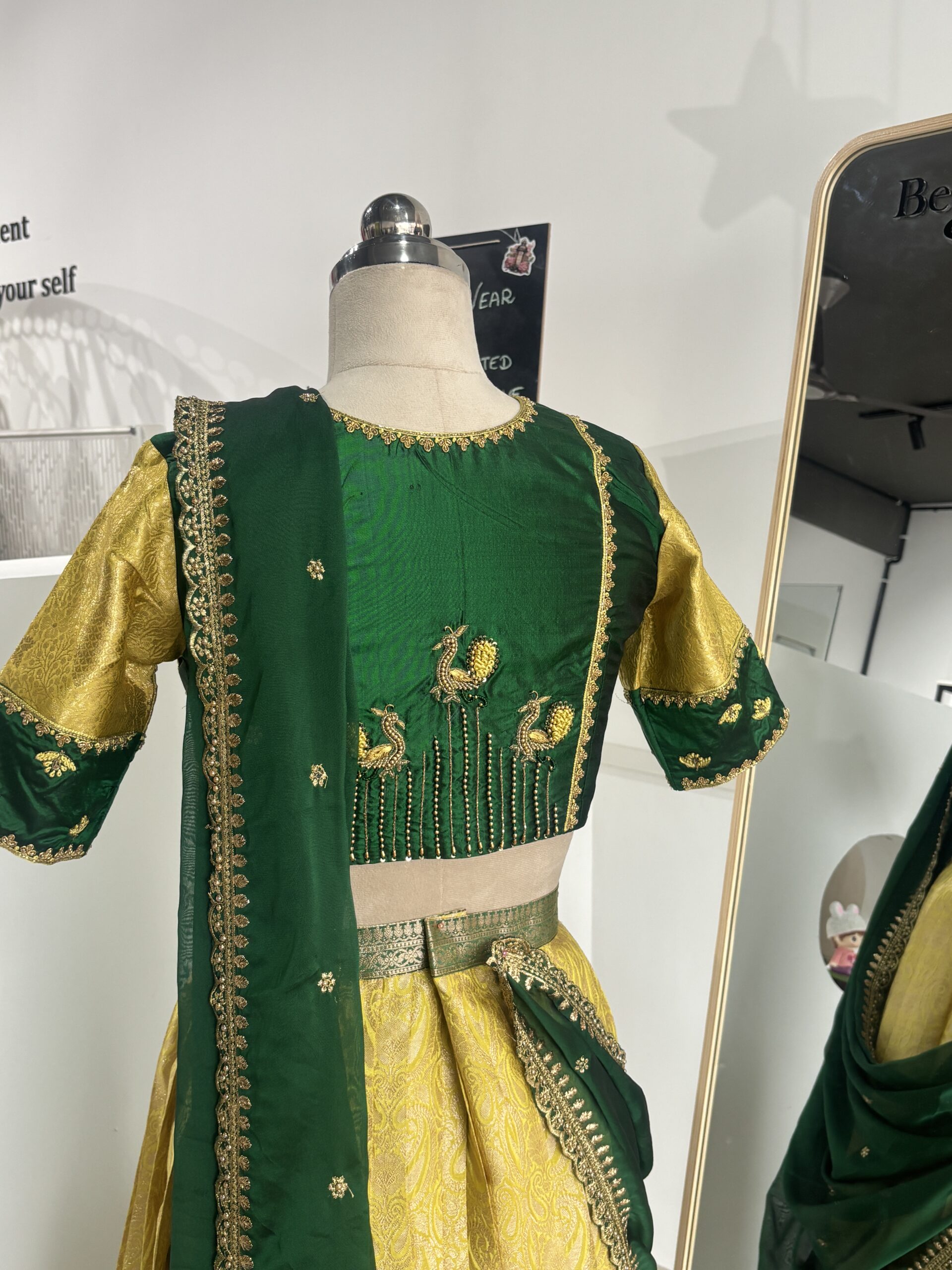 Bottle green hand embroidered blouse with peacock embroidery back design
